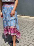 STEVIE HI LOW TIERED MAXI SKIRT IN BLUE FLORAL